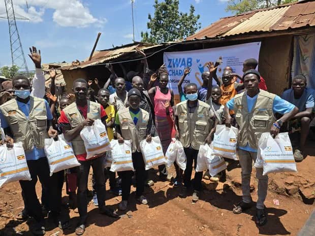 The Zwab team gathers with food-aid supplies.