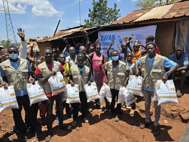 The Zwab team gathers with food-aid supplies.