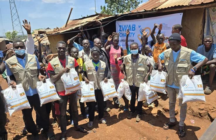 The Zwab team gathers with food-aid supplies.