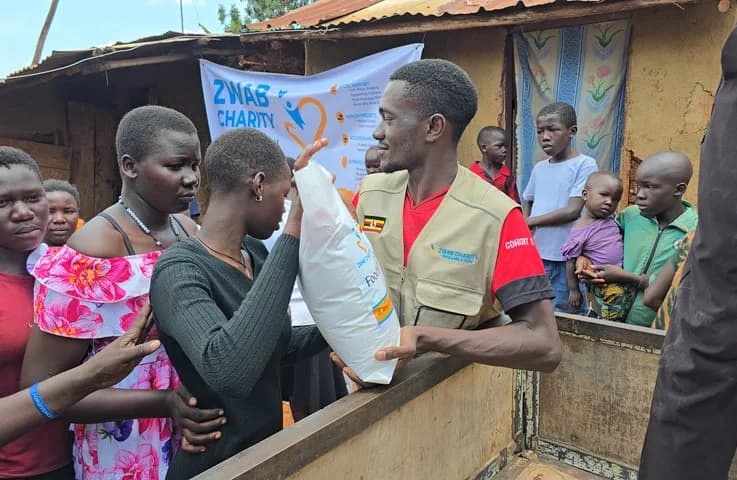 A food package is handed to a community member.
