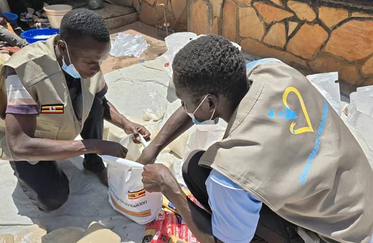 Team members sort food items into packages.