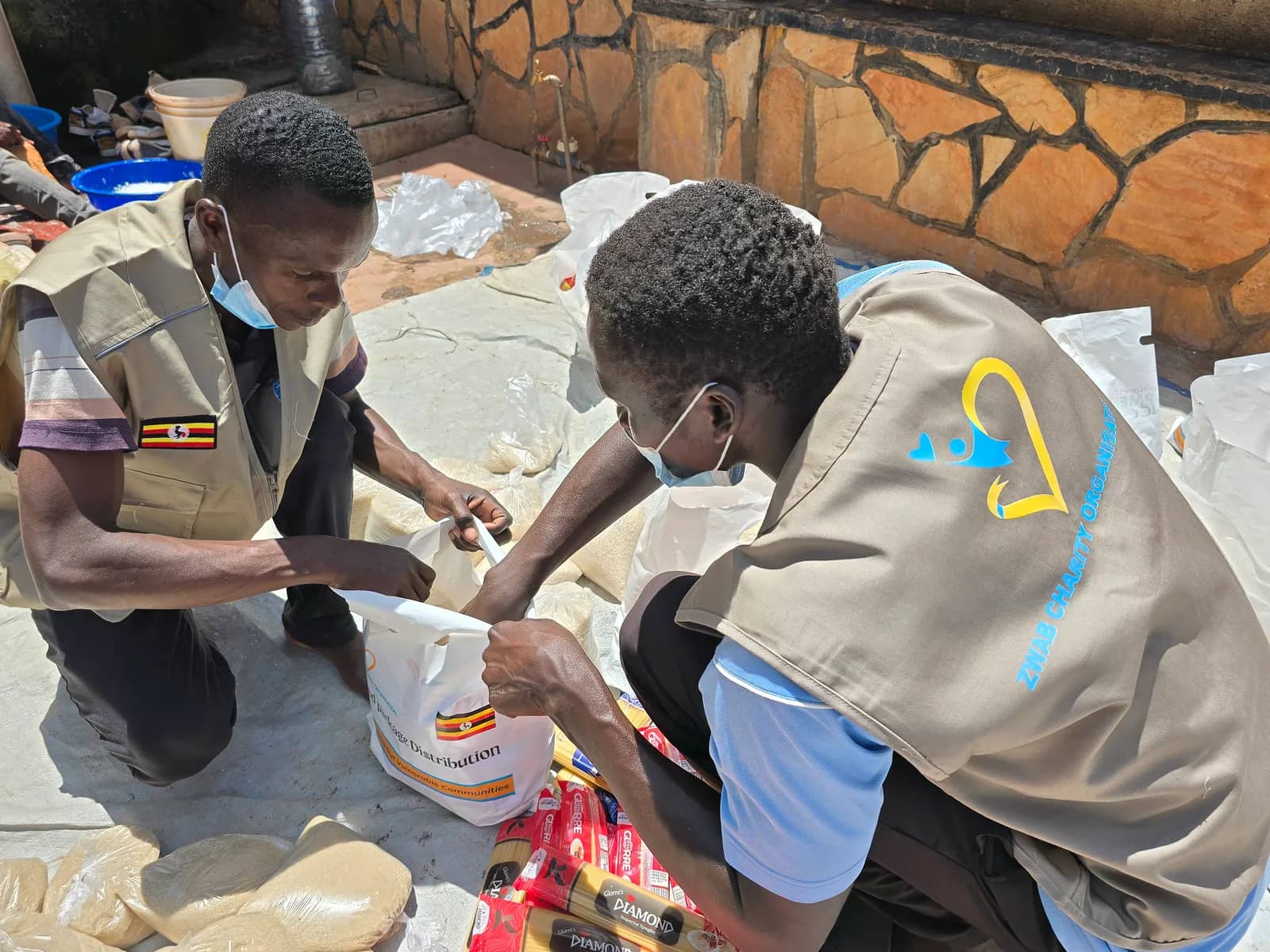 Zwab team members pack food supplies into bags.