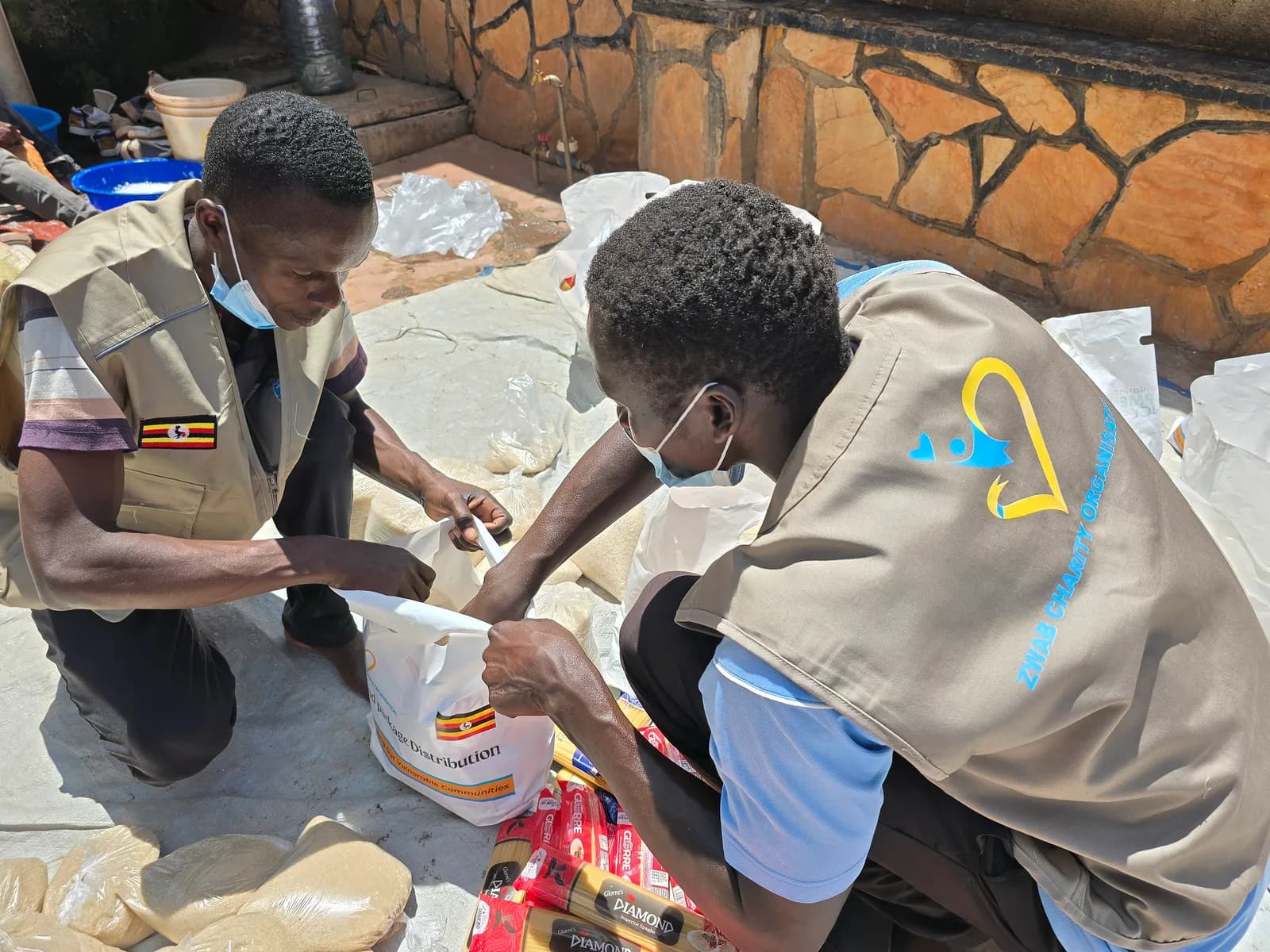 Zwab team members pack food supplies into bags.
